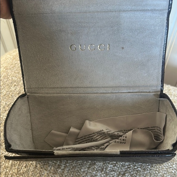 Authentic Gucci Elegant Black Sunglasses with Gold plated temples.